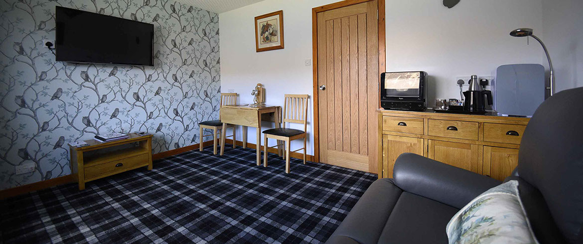 Loch Aluinn four poster bed and breakfast suite contains a spacious guest living room