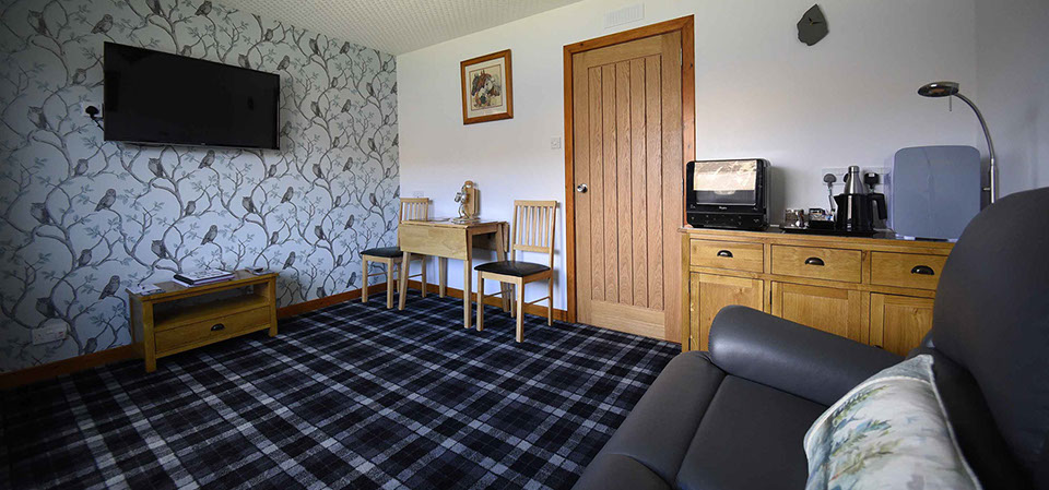 Loch Aluinn four poster bed and breakfast suite contains a spacious guest living room