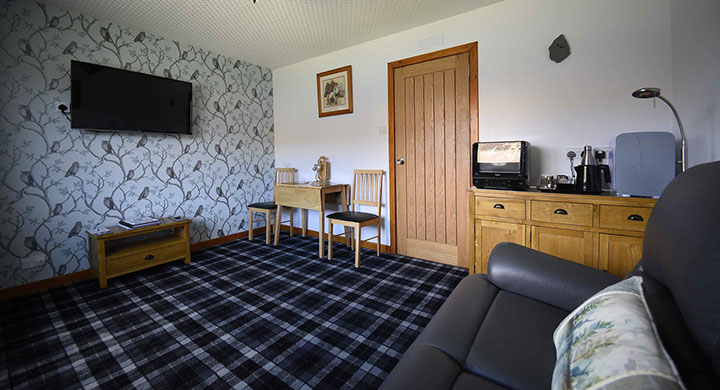 Loch Aluinn four poster bed and breakfast suite contains a spacious guest living room