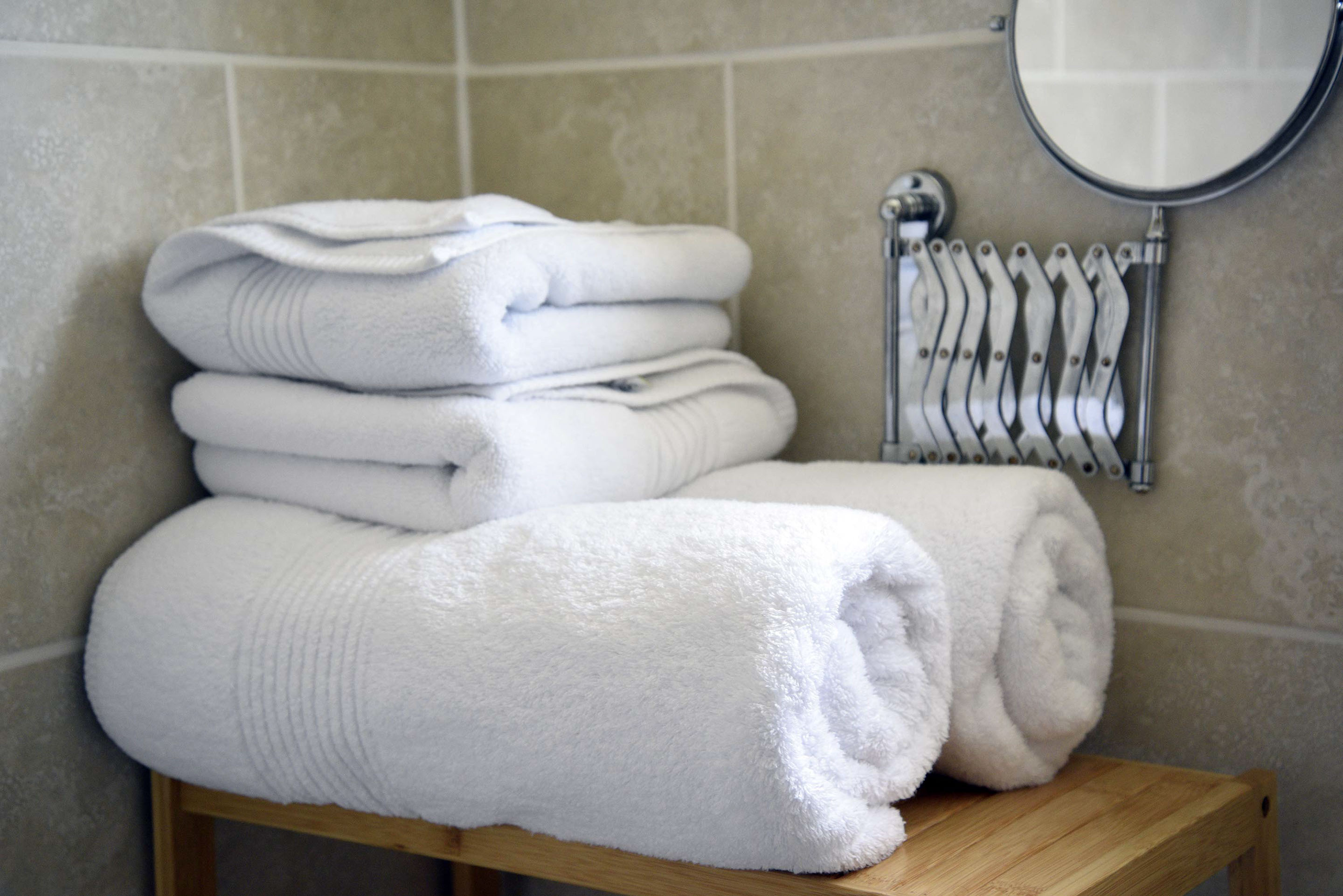 Relax in Taransay House Luxury Accommodation in Portree public seating area with woodburning stove