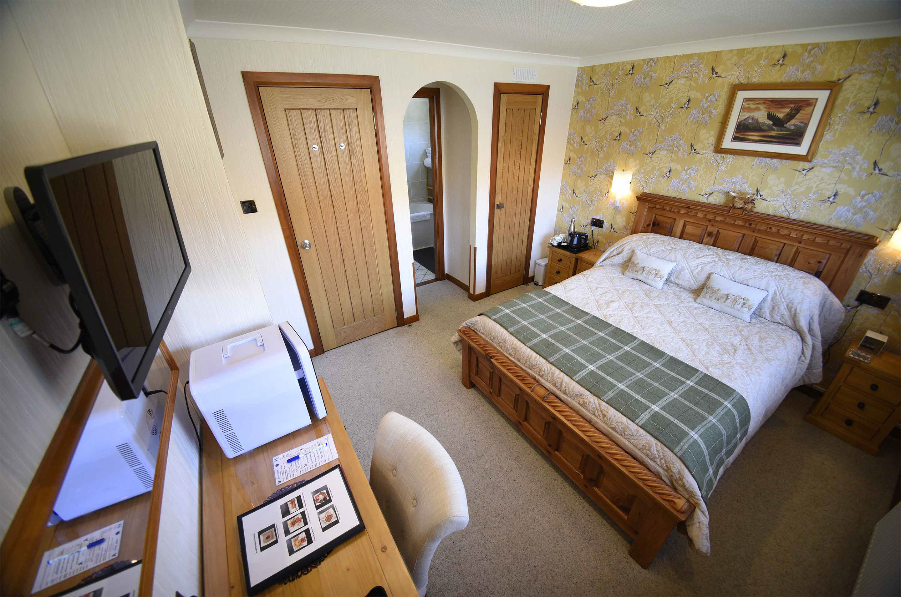 Relax in Taransay House Luxury Accommodation in Portree public seating area with woodburning stove