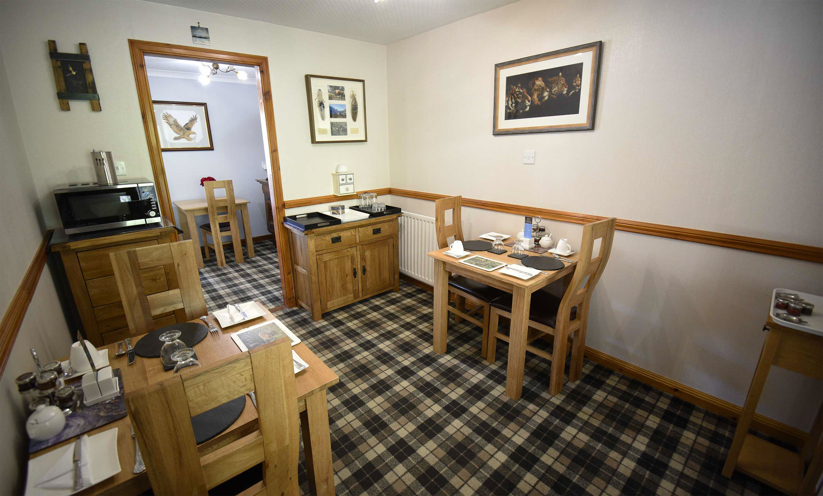 Relax in Taransay House Luxury Accommodation in Portree public seating area with woodburning stove