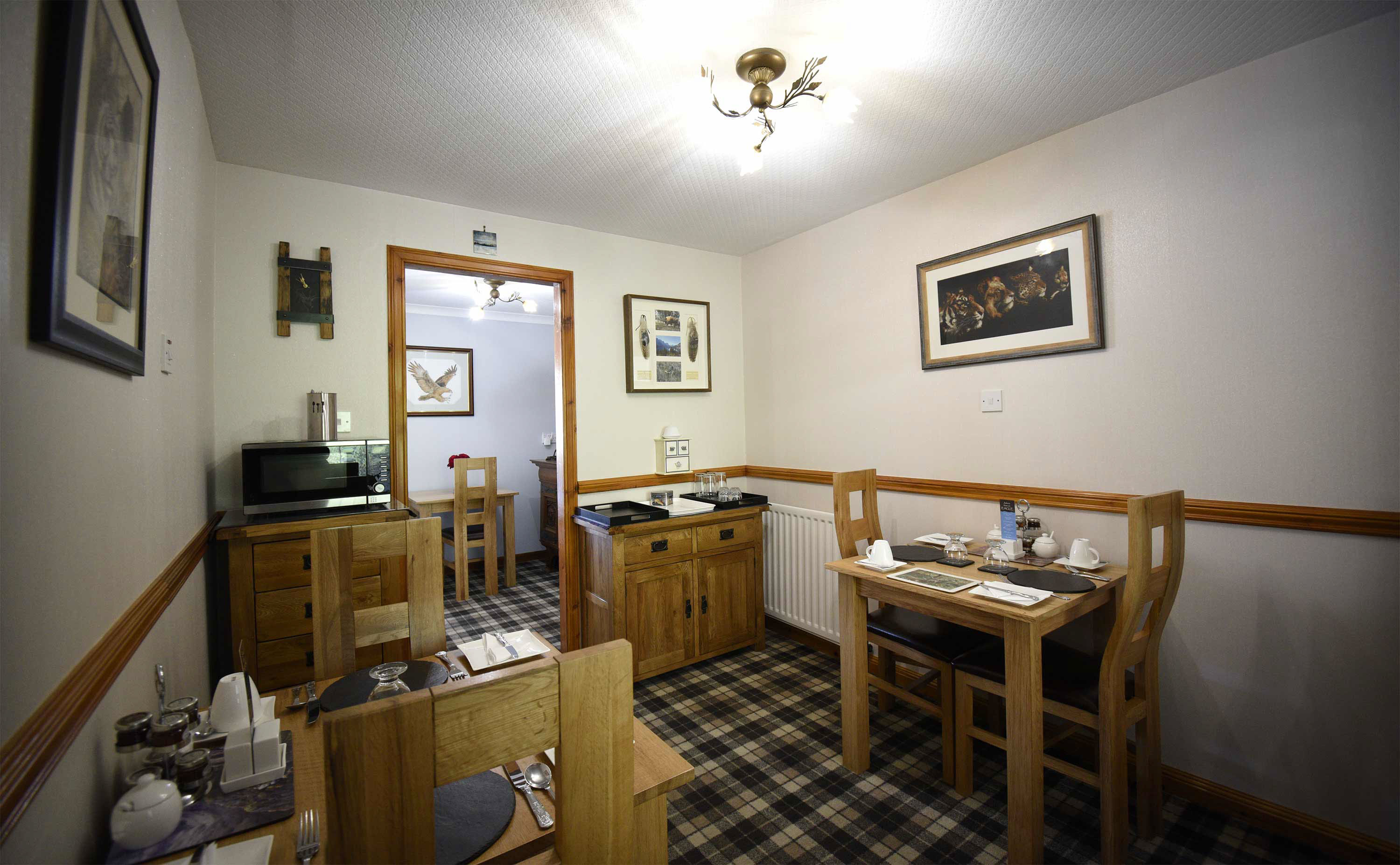 Relax in Taransay House Luxury Accommodation in Portree public seating area with woodburning stove