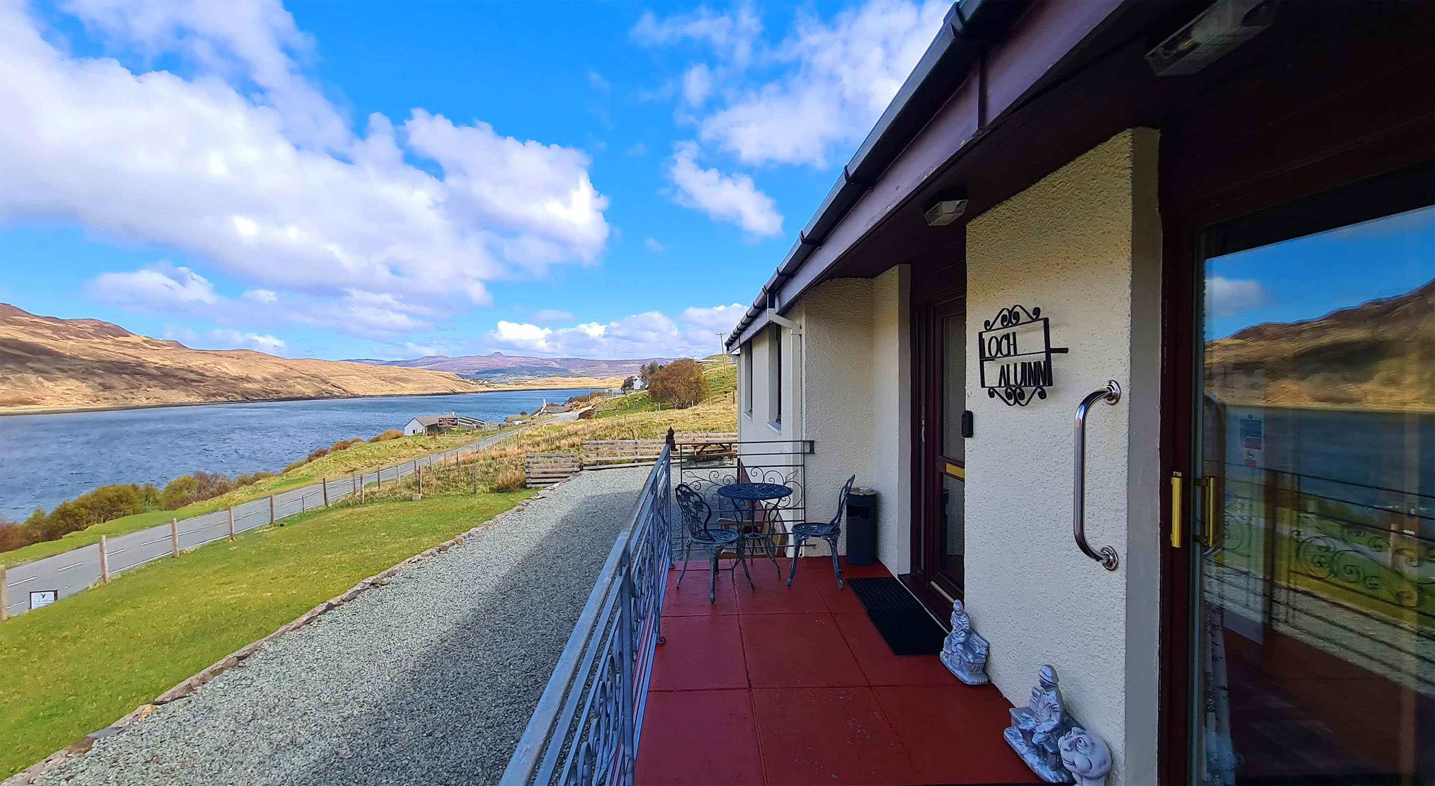 Relax in Taransay House Luxury Accommodation in Portree public seating area with woodburning stove